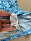 Fabric composition and gentle washing instructions label on ladies summer apparel