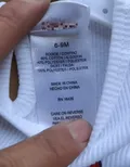 Care label showing 60% cotton 40% polyester bodice and 100% polyester skirt composition