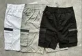 Front view of boys athletic color-block sports shorts with adjustable drawstring waistband