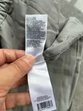 Fabric composition and machine washing instructions label on children activewear