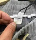 Care label and fabric composition tag, wholesale stocklot inspection photo