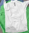 Men's long sleeve cycling jersey back view, reflective chevron logo and hidden zip pocket at hem