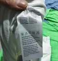 Care label and fabric composition tag, wholesale stocklot inspection photo