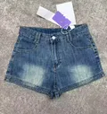 High-waisted distressed wash denim shorts with rolled cuffs, main product photo