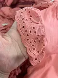 Broderie anglaise eyelet lace detail on girls pink flutter sleeve top for wholesale buyers