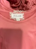 Neckline label and size tag showing size 8 on girls flutter sleeve top wholesale stock lot