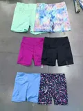 Front view of girls light green waffle knit hoodie and shorts 2-piece athletic sweatsuit set