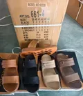 Four style variations of men's Arabic sandals in factory box packaging for wholesale distribution