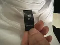 Care label and fabric composition tag, wholesale stocklot inspection photo