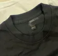 Close-up of crew neck collar and neck label on men's basic t-shirt
