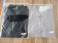 Men's light gray heather 65/35 cotton polyester polo shirt flat lay for wholesale bulk buyers