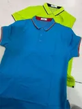 Two men's tipped polo shirts flat lay showing blue with red tipping and lime green with black tipping for wholesale buyers