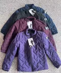 Four color diamond quilted men's lightweight puffer jackets fanned display in violet burgundy black and navy for bulk inventory