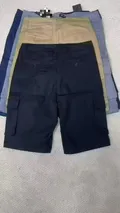 Back view of rugged men's utility shorts showcasing symmetrical rear welt pockets and heavy-duty double-stitched belt loops