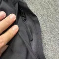 Close-up of zippered side pocket on men's nylon quick-dry shorts