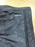 Close-up of the mesh lining durable stitching and drawstring on men swimwear