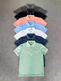 Care label showing 51.9% polyester 48% cotton 1.7% mulberry silk composition on men's polo shirt for bulk resale