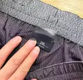 Close-up of elastic drawstring waistband on men's woven pants