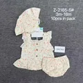 Close-up of premium double-layer cotton gauze fabric texture and delicate ruffles on baby girl summer top