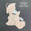 Close-up of premium double-layer cotton gauze fabric texture and delicate ruffles on baby girl summer top