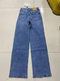 Back view of casual vintage style women's wide leg trousers showcasing seamless pockets placement