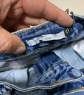 Original factory clearance brand clothing tags and barcode label on brand new pristine long pants