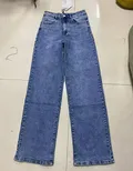 Back view of casual vintage style women's wide leg trousers showcasing seamless pockets placement