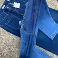 Close-up of contrast stitching and denim fabric texture