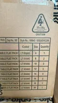 Shipping carton for women's cotton shorts showing flat pack table with size run 6-20 and lt khaki color for wholesale distribution