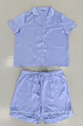 Front view of an elegant model wearing a women's dusty rose floral satin pajamas short sleeve 2-piece set