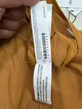 Fabric composition and washing instructions label on ladies heavy-weight tailored knitwear
