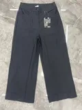 Front flat lay view of women's premium high-waisted wide-leg tailored trousers in dark obsidian colorway