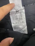 Inside laundering and fabric composition care label detailing anti-wrinkle machine washable standards