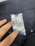 Inside laundering and fabric composition care label detailing anti-wrinkle machine washable standards