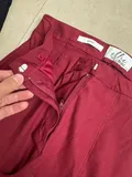 Close-up of the elegant pleats and smooth fabric texture on women casual trousers