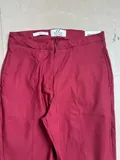 Close-up of the elegant pleats and smooth fabric texture on women casual trousers