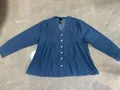 Full product silhouette displaying the elegant medium indigo wash of the lightweight split collar denim jacket