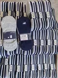 Detailed view of the curated neutral colorways including light gray, heather navy, and solid black pairs inside the bundle