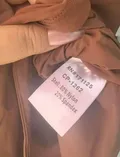 Fabric composition and gentle washing instructions label on ladies soft knitwear