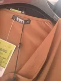 Original factory clearance brand labels and tags attached to brand new pristine ladies clothing