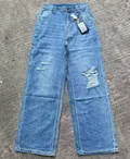 Women's ripped wide-leg jeans in light blue denim wash for wholesale stocklot and bulk jeans resale