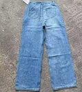 Back view of women's non-stretch wide-leg denim jeans showing classic pocket detail for wholesale buyers
