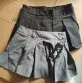 Women's trendy mini skirt wholesale stocklot in grey and black colors for fashion resellers